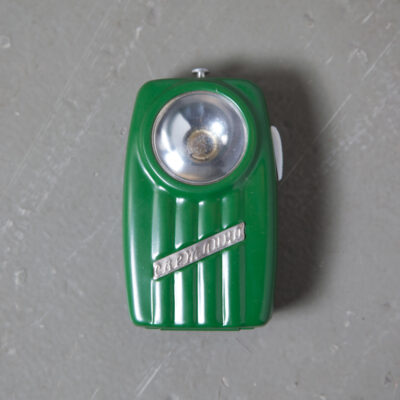 Super Cool Totally Useless vintage Pocket Flashlight no bulb battery tin painted box green red blue olive sage navy eastern block bloc planned economy soviet retro mid-century new out of the box old stock plastic lens scratched belt loop pocket clip