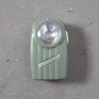 Super Cool Totally Useless vintage Pocket Flashlight no bulb battery tin painted box green red blue olive sage navy eastern block bloc planned economy soviet retro mid-century new out of the box old stock plastic lens scratched belt loop pocket clip