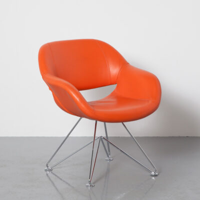 Volpe 8220/3 Chair orange leatherette Norbert Geelen kusch+co upholstered seat shell sculptural chromed bar steel cross frame contemporary modern 2000s seating recyclable German quality