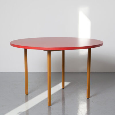 Two-Colour Table Muller van Severen HAY red maroon over tan ochre round circle powder-coated steel tube base MDF Valchromat top mottled wood fiber contemporary modern dining bistro